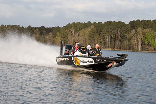bass-boat-with-logos-cruising-across-water