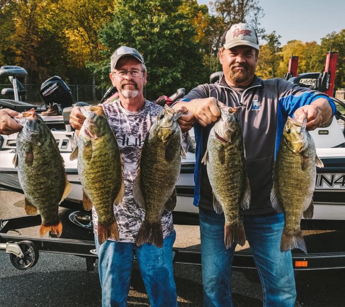 Farver and Cline holding up 5 smallmouth bass on day 1 of the Megaware R&B Bass Circuit Classic