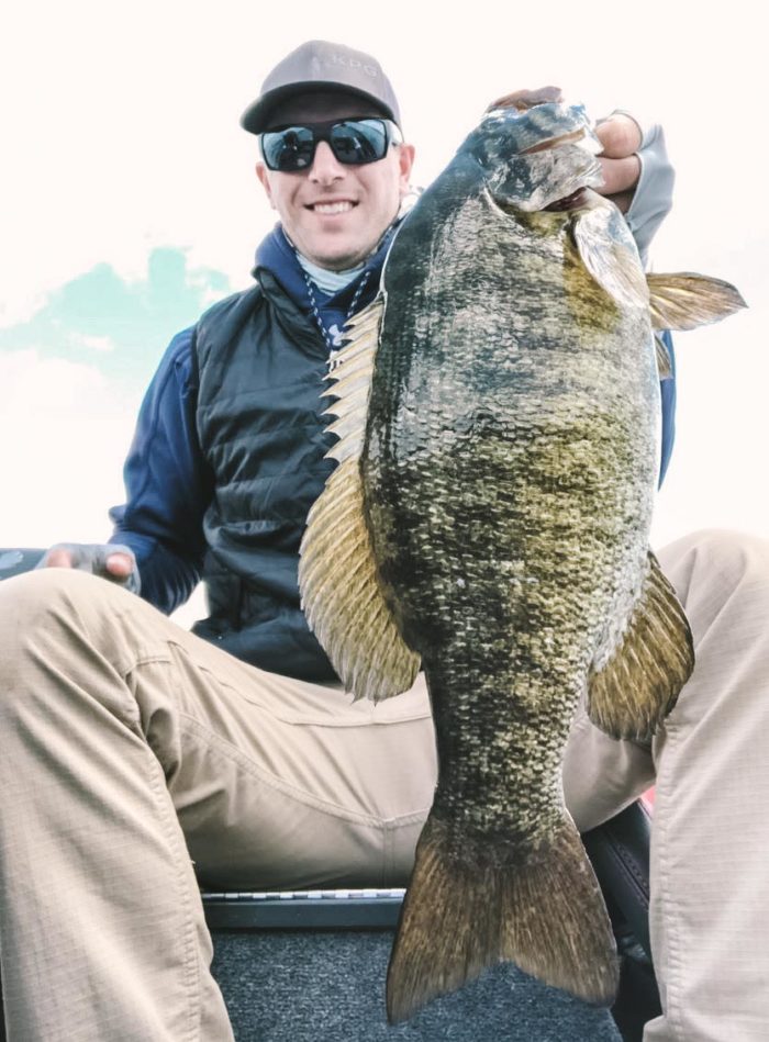 Kyle Gelles showing a large Smallmouth Bass