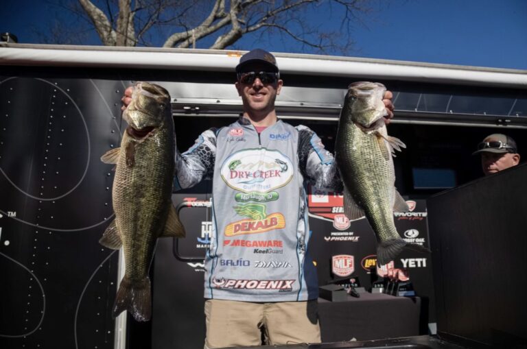 Kyle Gelles with 2 largemouth bass at a co-angler weigh in