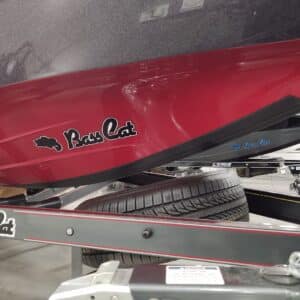 BassCat boat with a red hull and black Megaware KeelGuard